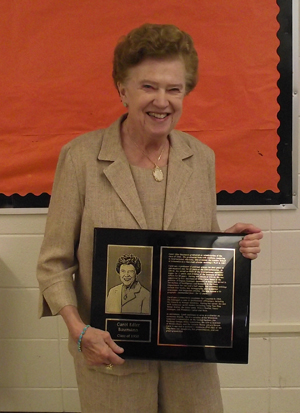 Carol Edler Baumann with plaque