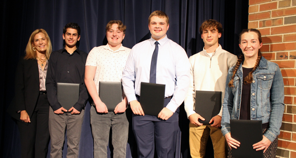 presenter and students with awards