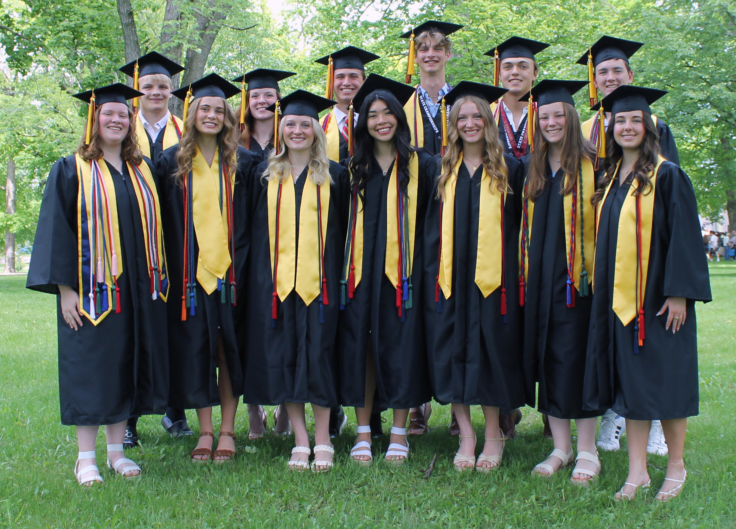 students in gold stoles